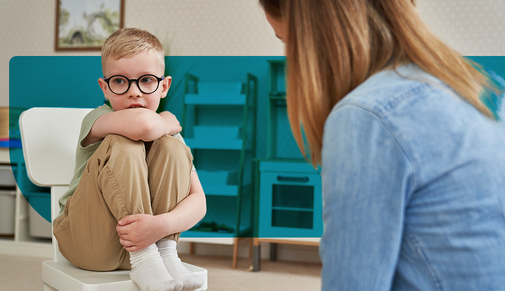 Child engaging in therapy session with a technician